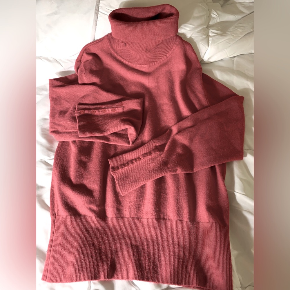 Vintage brand, large turtle neck sweater with button details on wrists. A Beauty